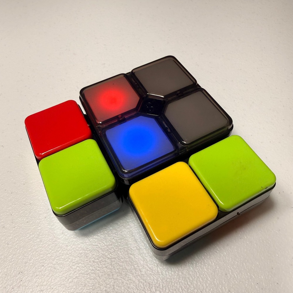 Rubik's Race Electronic Handheld Puzzle Game Light Up Sliding Tile Brain Teaser